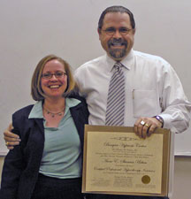 Cal Banyan presenting Anne with CPHI Certification Professional Hypnotherapy Certification